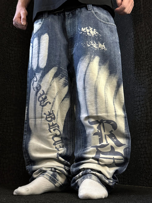 Raw Blue baggy jeans, blue and white bleached wash – gothic Raw Blue lettering down the left leg and RB monogram on the right – front view, worn – vintage Y2K, size W32 / M, ships from Germany / Versand aus Deutschland